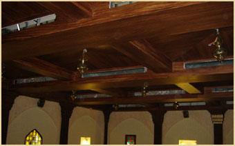 Designers Consortium wood beam ceiling with arched windows