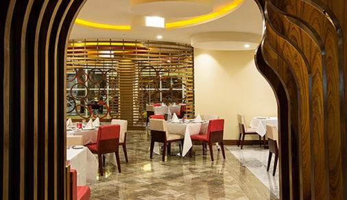Ghaya Grand Hotel carved wood archway