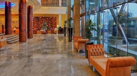 Ghaya Grand Hotel lobby lounge with marble columns