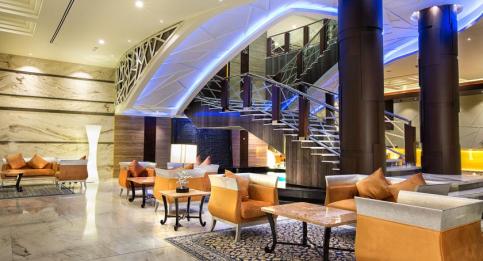 Ghaya Grand Hotel lobby staircase with accent lighting