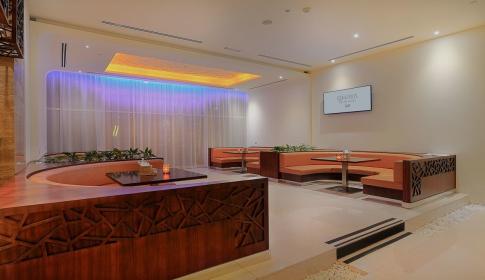 Ghaya Grand Hotel lounge with mirror panel