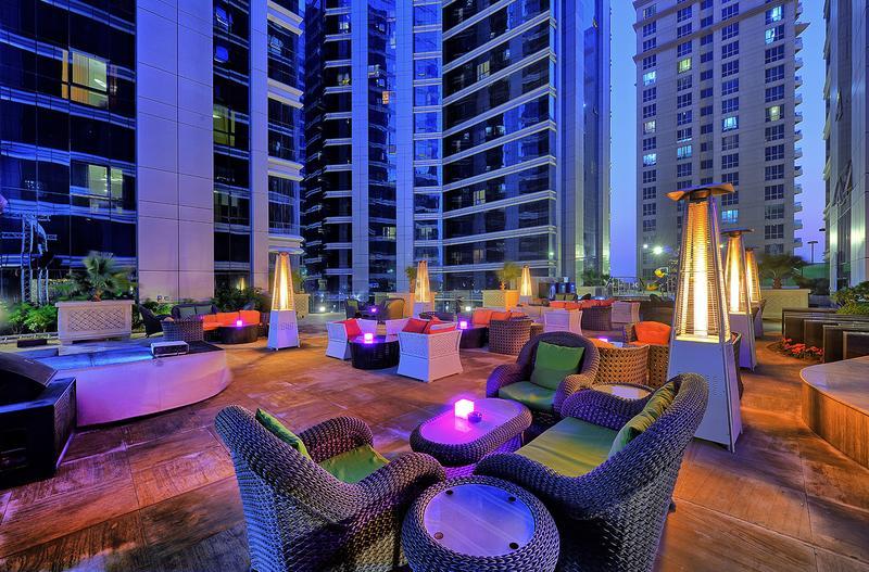 Ghaya Grand Hotel rooftop terrace at dusk