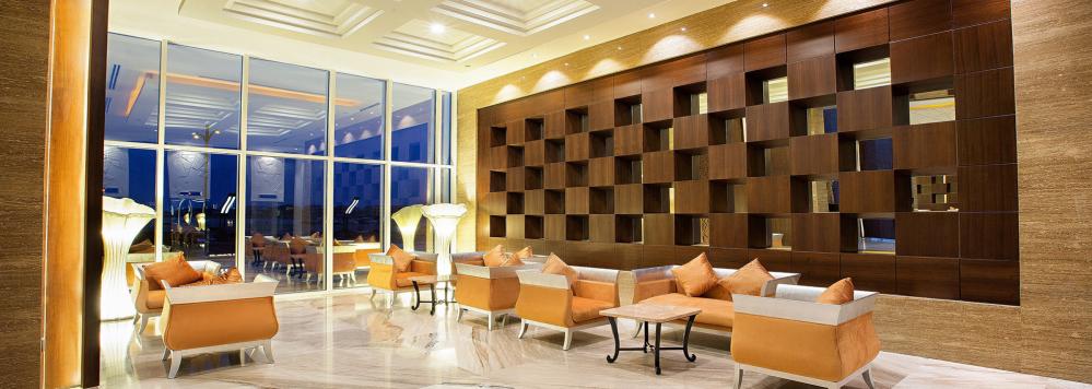 Ghaya Grand Hotel lounge with skyline view