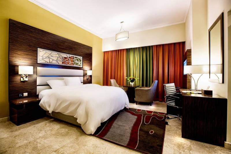 Hotel apartment bedroom with sitting area