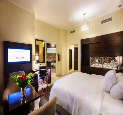 Hotel apartment bedroom with mirrored headboard