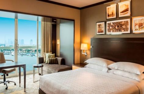 Sheraton Dubai Creek bedroom with skyline view