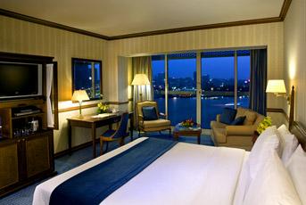 Sheraton Dubai Creek suite bedroom at dusk
